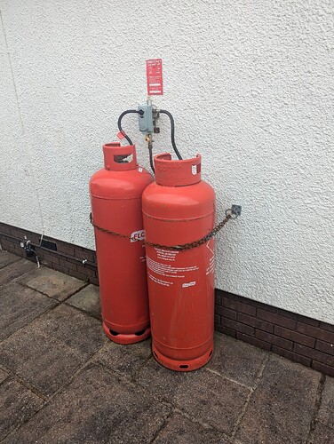 High quality image of two gas canisters against a white wall