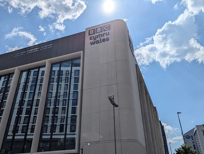 A Pixel 6 Pro image of the Central Square building with BBC Cymru Wales branding visible. The image feels generally much more vibrant compared to the 3DS image but the sun is shining at the top.