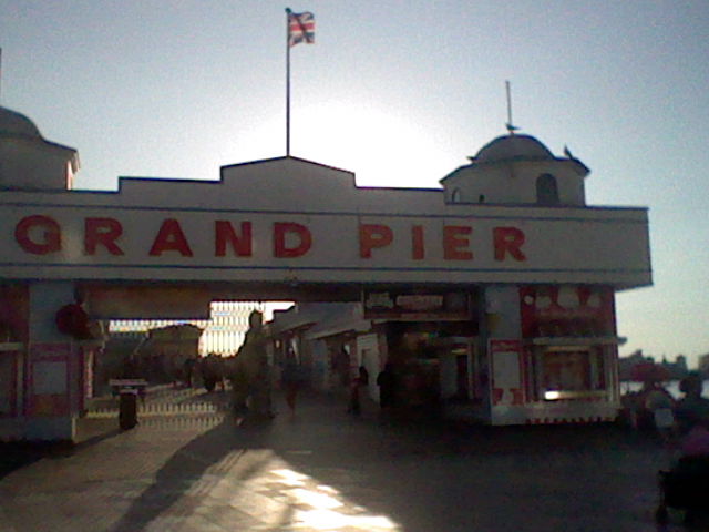 A half shut Grand Pier in Weston-super-Mare with some people attempting to queue
